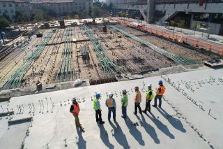 Construction team discussing project plans on-site.
